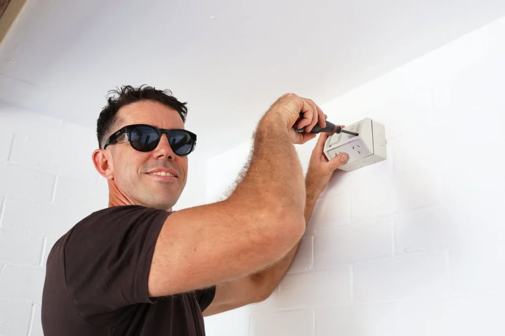 Licensed electrician upgrading a switchboard in a Perth home