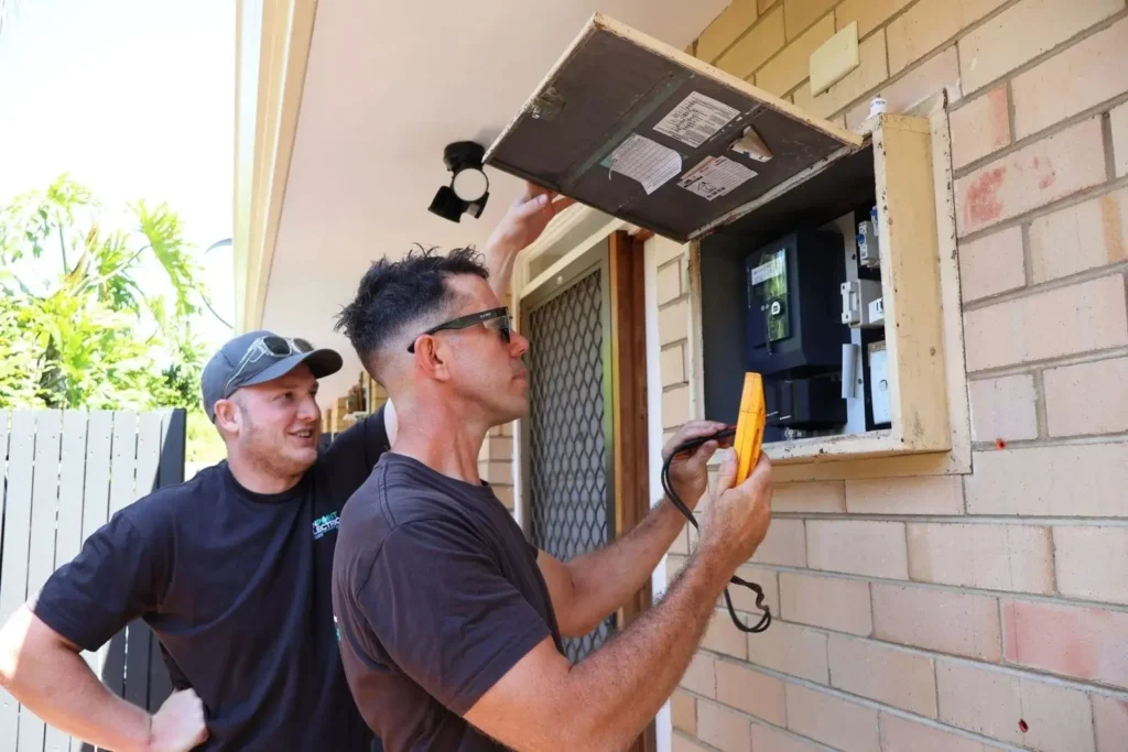 Electrician installing a home EV charger in a Perth garage